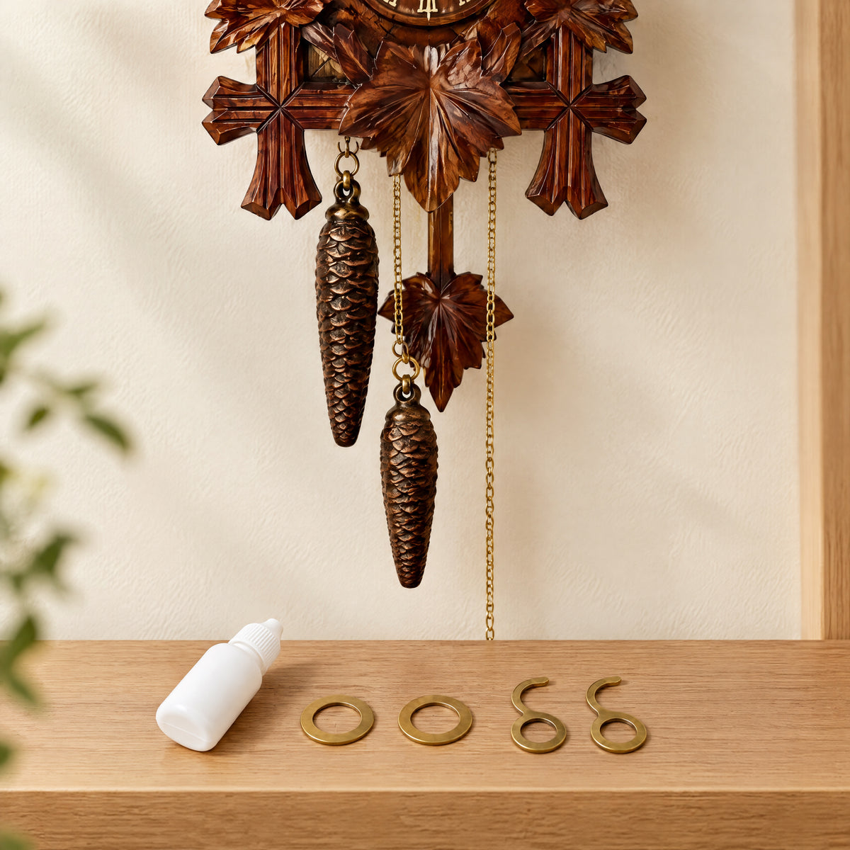 Cuckoo Clock Care Kit: Clock Oil and Chain Hooks, three-quarter view