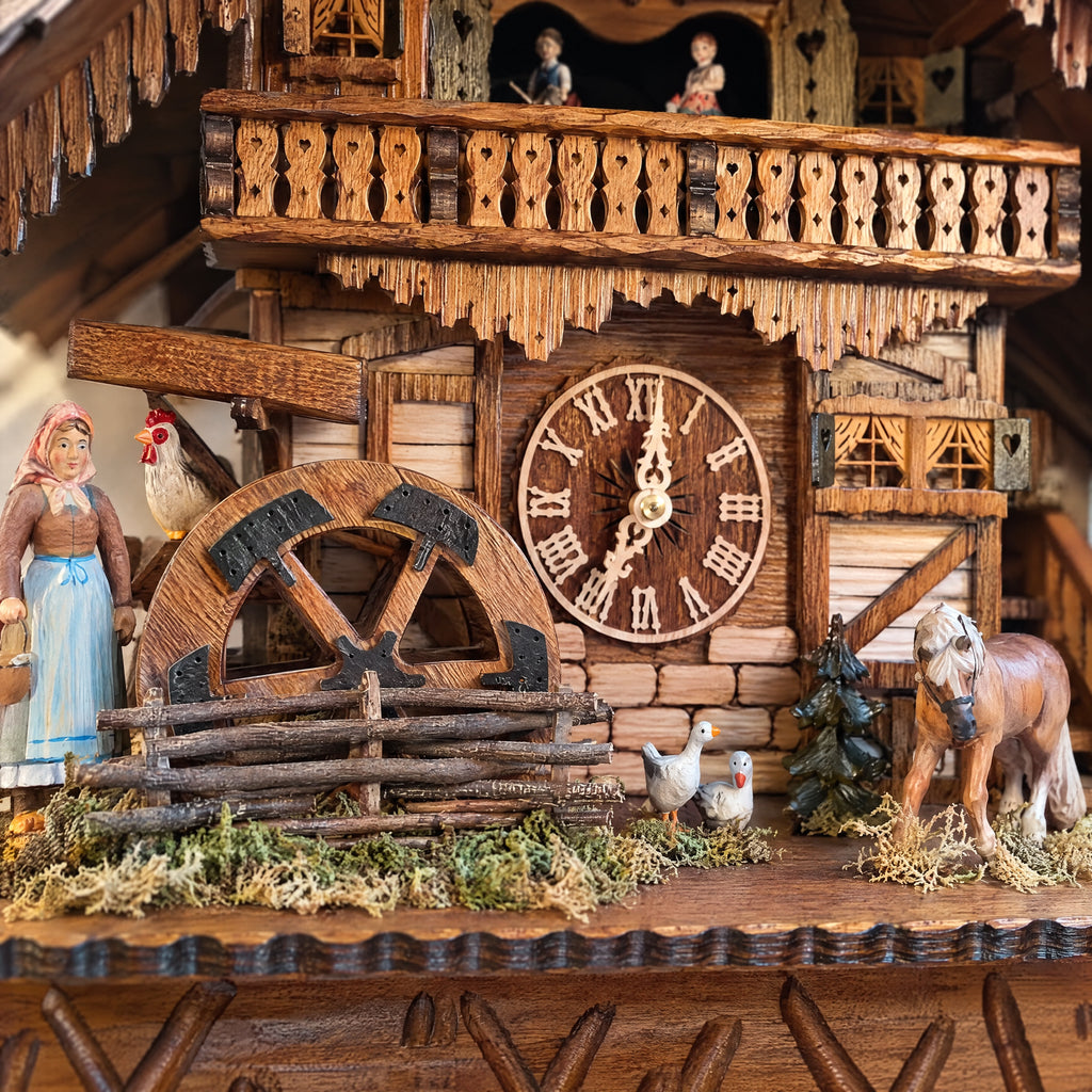 Romba Farmer Couple 8-Day Musical Grand Chalet Cuckoo Clock, close-up detail