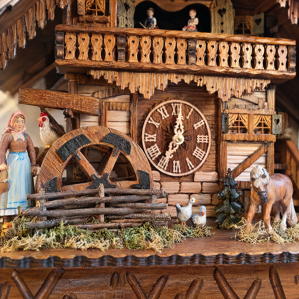 Romba Farmer Couple 8-Day Musical Grand Chalet Cuckoo Clock, close-up detail